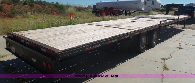image for item L5974 2009 RMST flatbed trailer