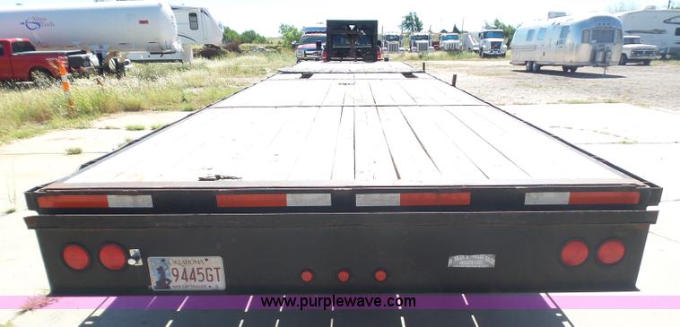 image for item L5974 2009 RMST flatbed trailer