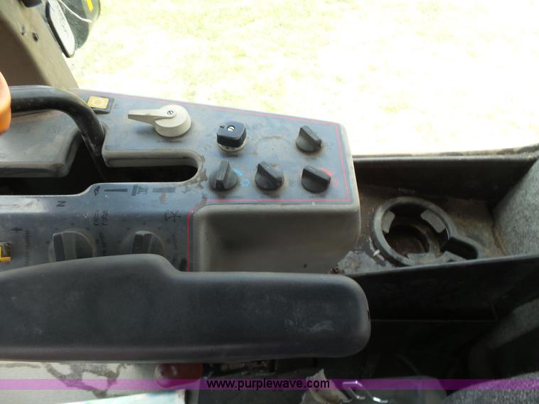 image for item K3113 2003 MacDon 9352 self-propelled windrower