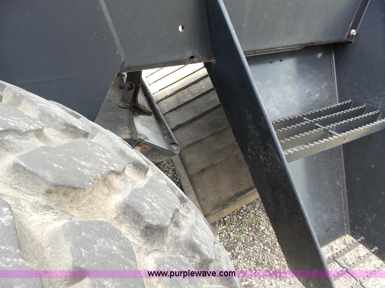 image for item K3113 2003 MacDon 9352 self-propelled windrower