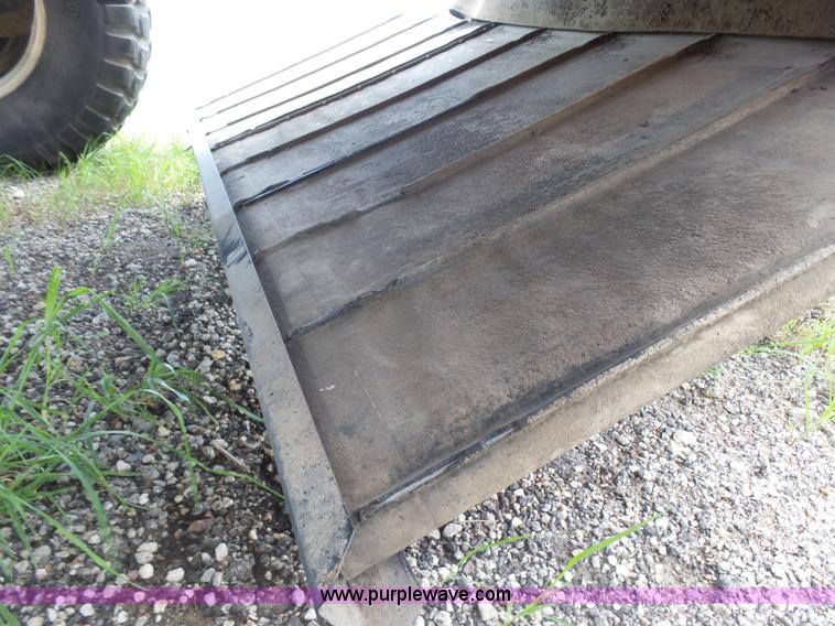 image for item K3113 2003 MacDon 9352 self-propelled windrower