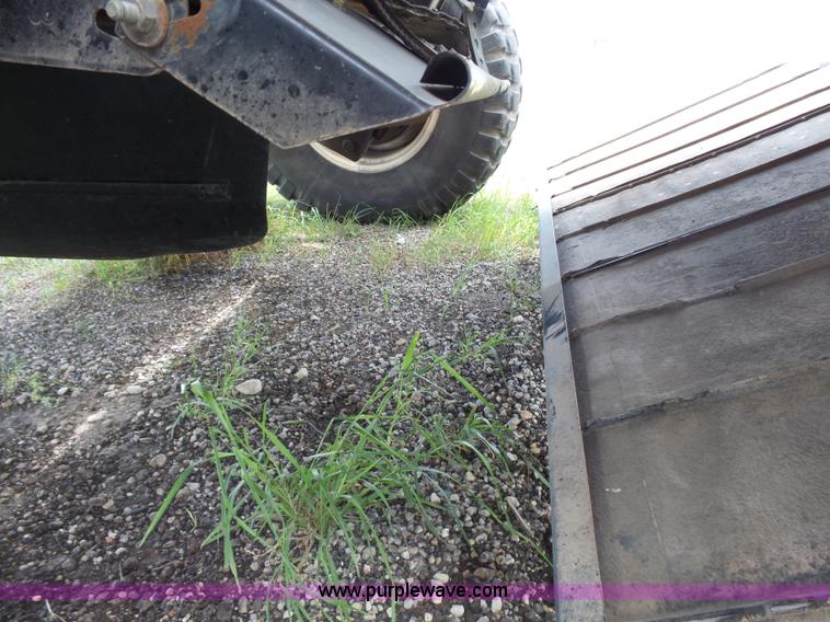 image for item K3113 2003 MacDon 9352 self-propelled windrower