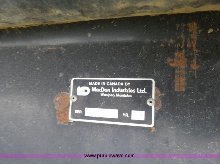 image for item K3113 2003 MacDon 9352 self-propelled windrower