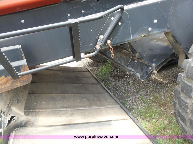 image for item K3113 2003 MacDon 9352 self-propelled windrower