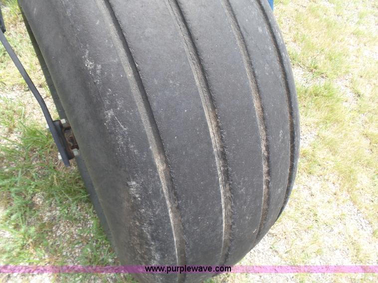 image for item K3113 2003 MacDon 9352 self-propelled windrower