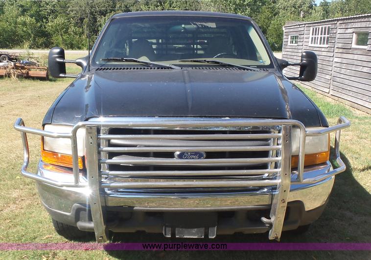 image for item CD9392 2000 Ford F250 Super Duty SuperCab flatbed pickup truck
