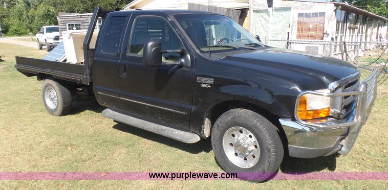 image for item CD9392 2000 Ford F250 Super Duty SuperCab flatbed pickup truck