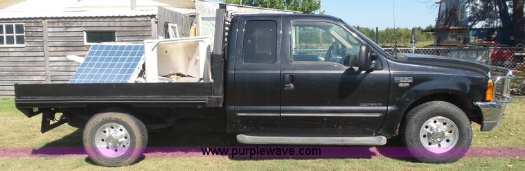 image for item CD9392 2000 Ford F250 Super Duty SuperCab flatbed pickup truck