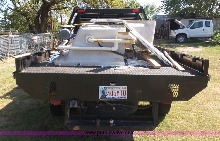 image for item CD9392 2000 Ford F250 Super Duty SuperCab flatbed pickup truck