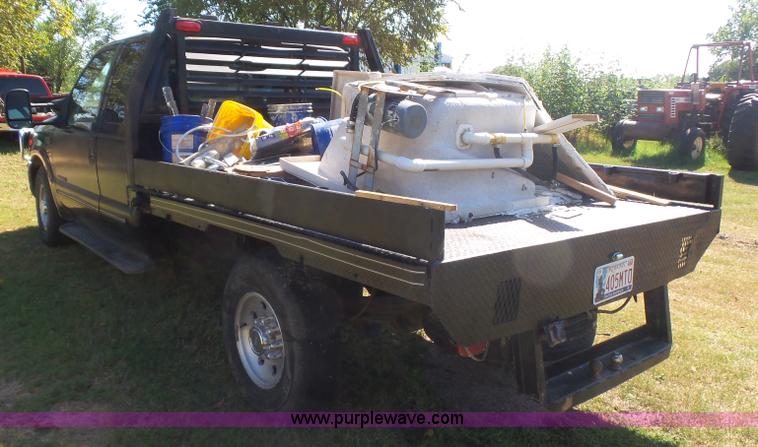 image for item CD9392 2000 Ford F250 Super Duty SuperCab flatbed pickup truck