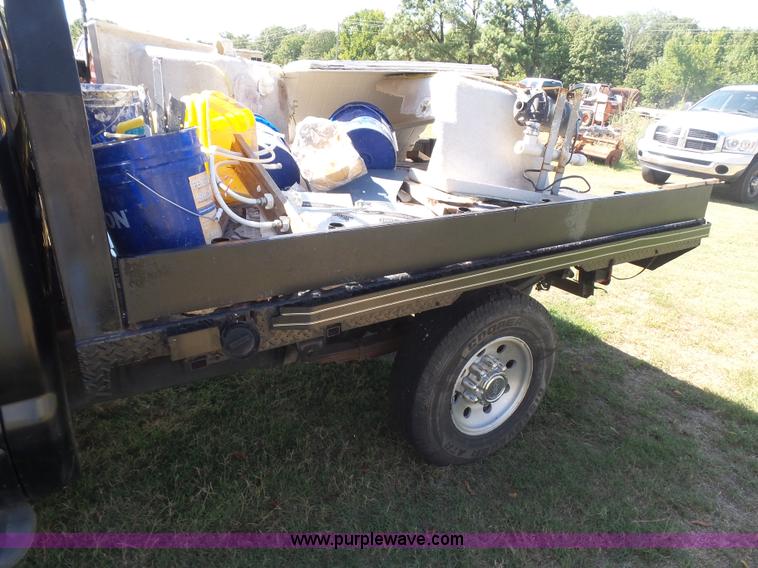 image for item CD9392 2000 Ford F250 Super Duty SuperCab flatbed pickup truck