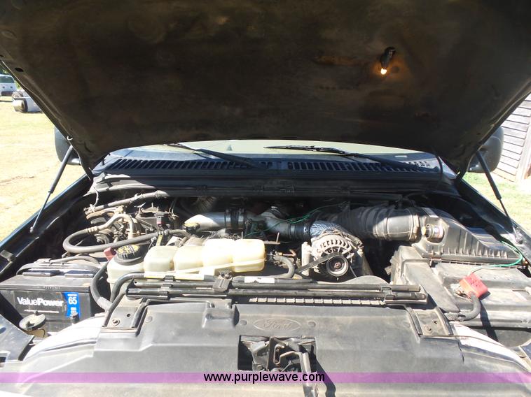 image for item CD9392 2000 Ford F250 Super Duty SuperCab flatbed pickup truck