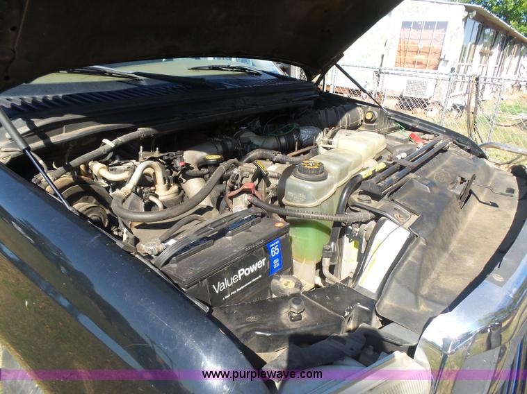 image for item CD9392 2000 Ford F250 Super Duty SuperCab flatbed pickup truck