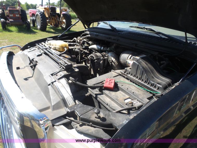 image for item CD9392 2000 Ford F250 Super Duty SuperCab flatbed pickup truck