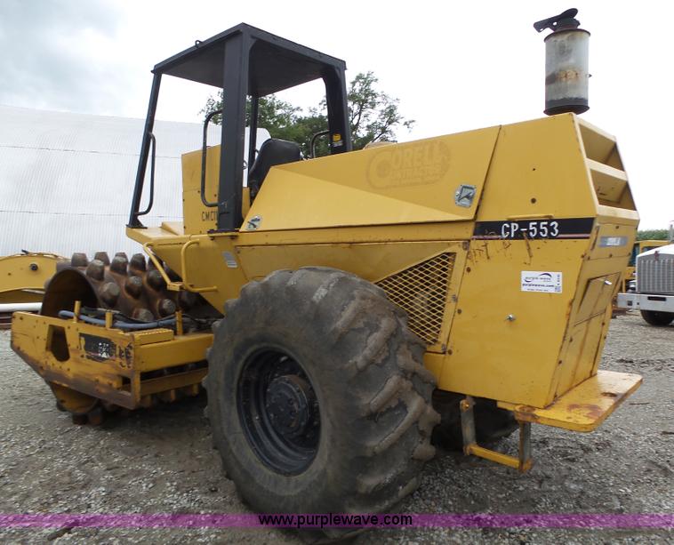 image for item K8446 1988 Caterpillar CP553 single drum pad foot compactor