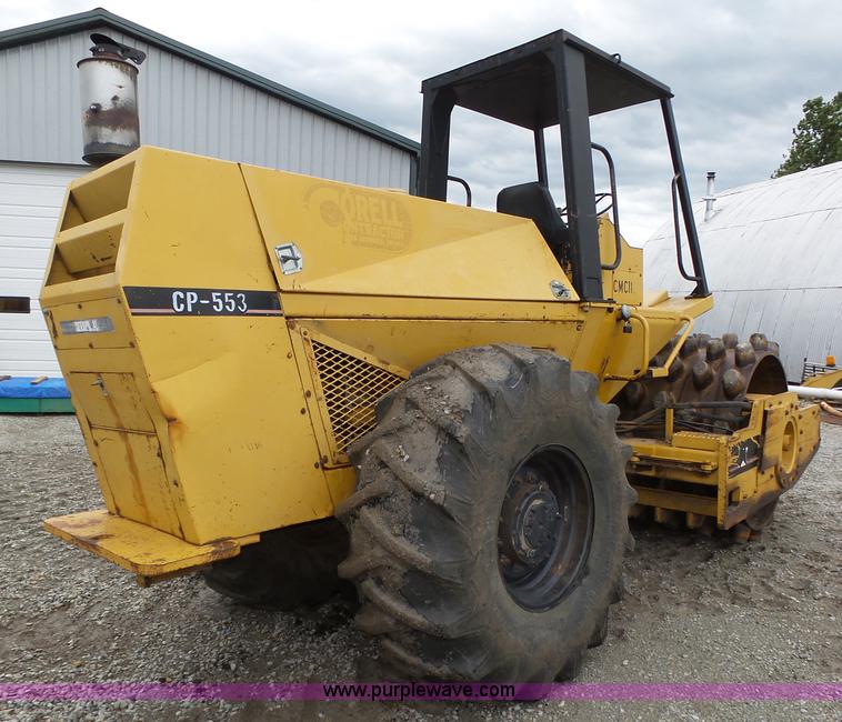 image for item K8446 1988 Caterpillar CP553 single drum pad foot compactor