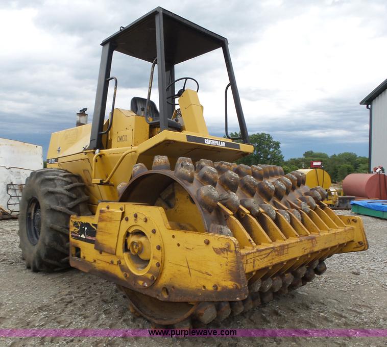 image for item K8446 1988 Caterpillar CP553 single drum pad foot compactor