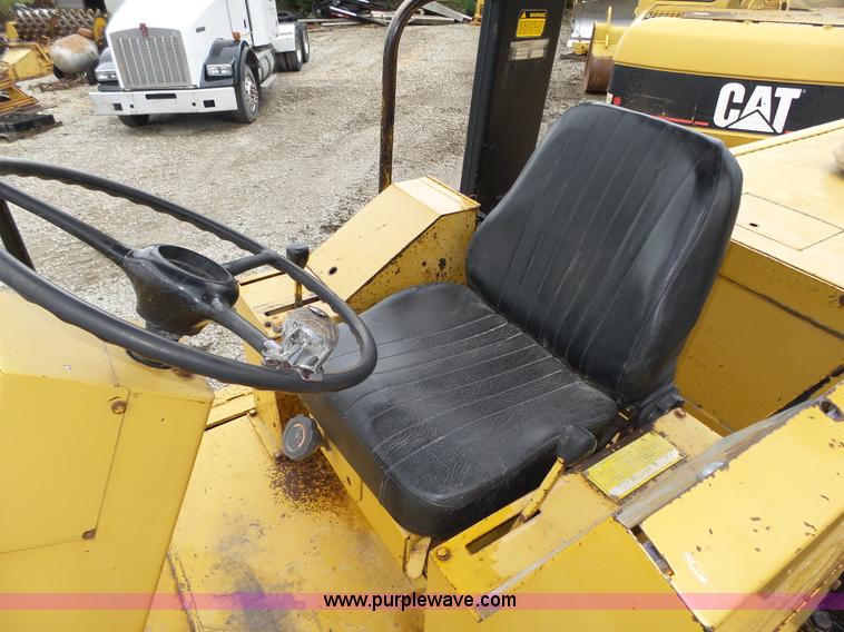 image for item K8446 1988 Caterpillar CP553 single drum pad foot compactor