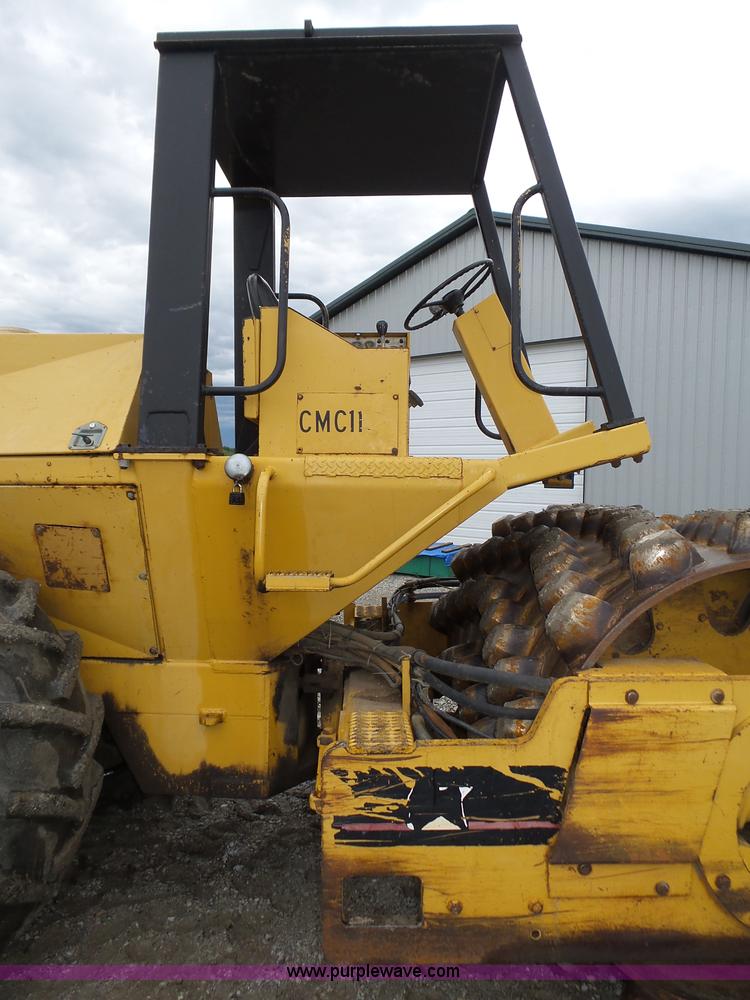 image for item K8446 1988 Caterpillar CP553 single drum pad foot compactor