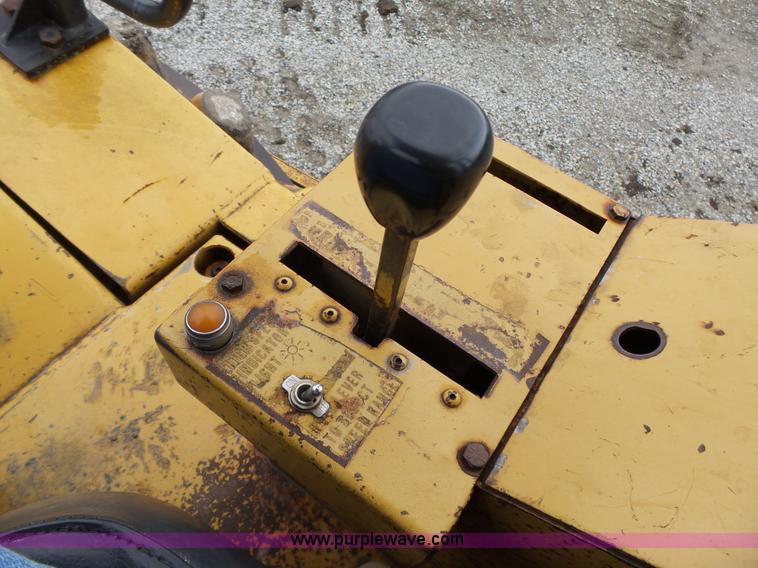 image for item K8446 1988 Caterpillar CP553 single drum pad foot compactor