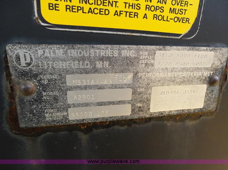 image for item K8446 1988 Caterpillar CP553 single drum pad foot compactor