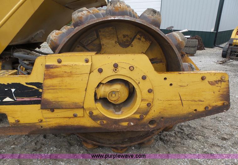 image for item K8446 1988 Caterpillar CP553 single drum pad foot compactor
