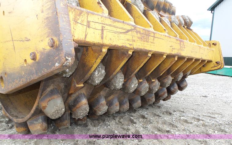 image for item K8446 1988 Caterpillar CP553 single drum pad foot compactor