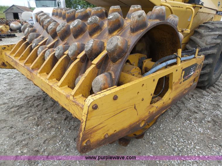 image for item K8446 1988 Caterpillar CP553 single drum pad foot compactor