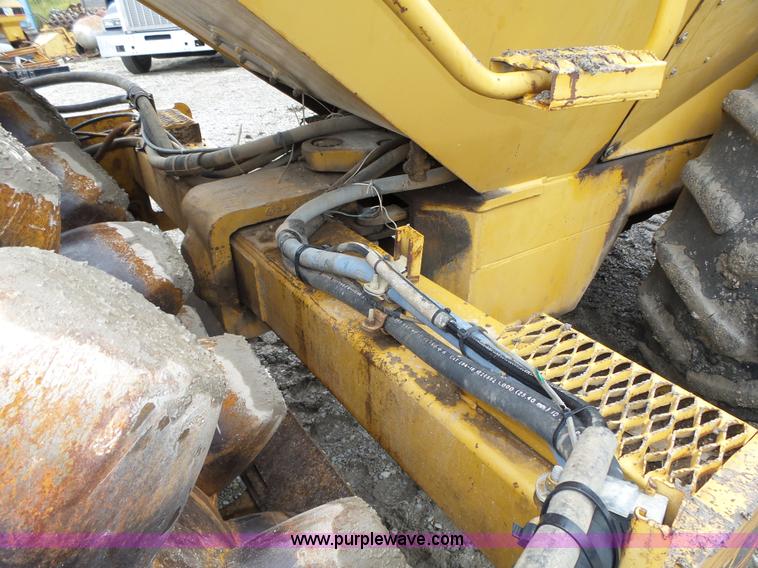 image for item K8446 1988 Caterpillar CP553 single drum pad foot compactor