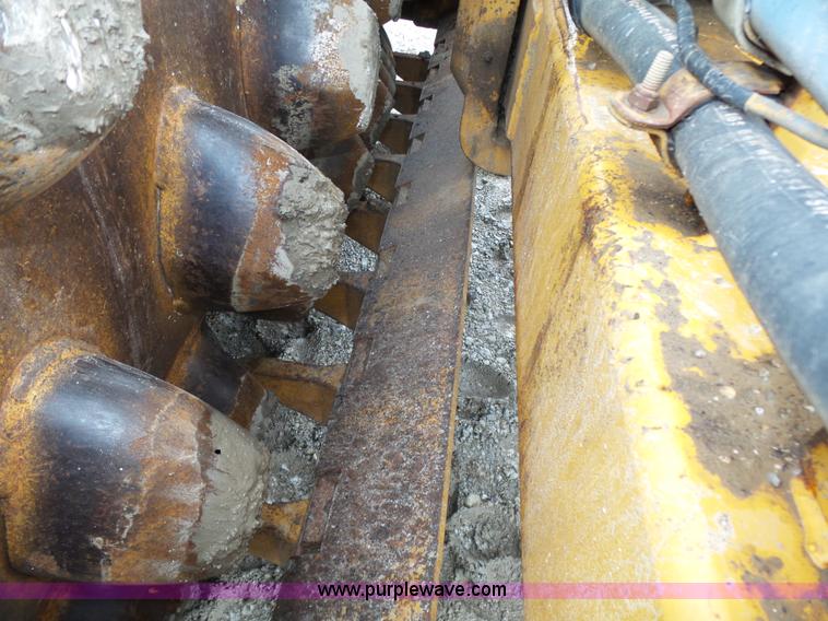 image for item K8446 1988 Caterpillar CP553 single drum pad foot compactor