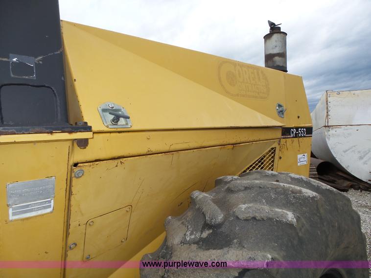 image for item K8446 1988 Caterpillar CP553 single drum pad foot compactor