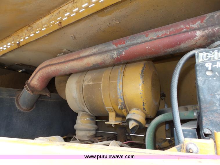 image for item K8446 1988 Caterpillar CP553 single drum pad foot compactor