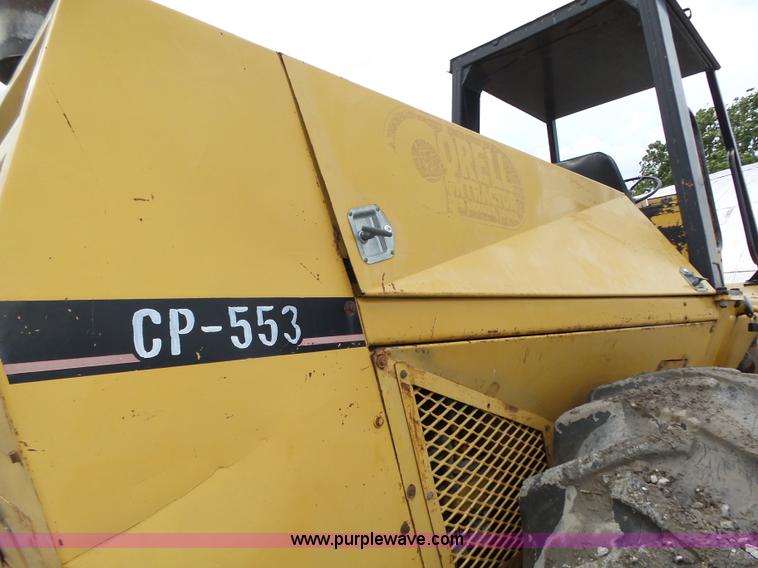 image for item K8446 1988 Caterpillar CP553 single drum pad foot compactor