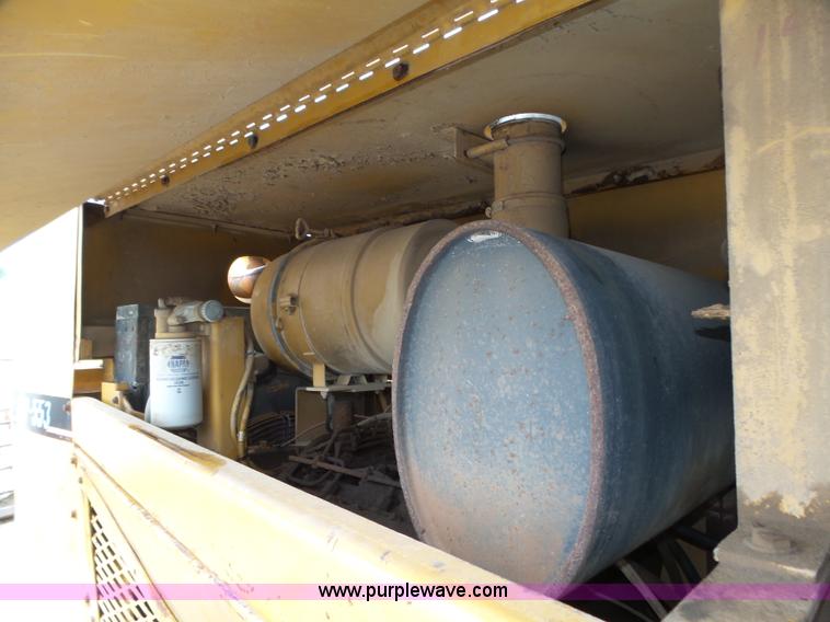 image for item K8446 1988 Caterpillar CP553 single drum pad foot compactor