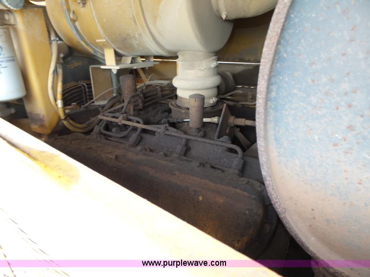 image for item K8446 1988 Caterpillar CP553 single drum pad foot compactor