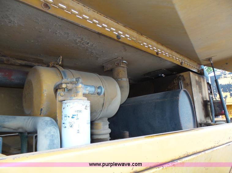 image for item K8446 1988 Caterpillar CP553 single drum pad foot compactor