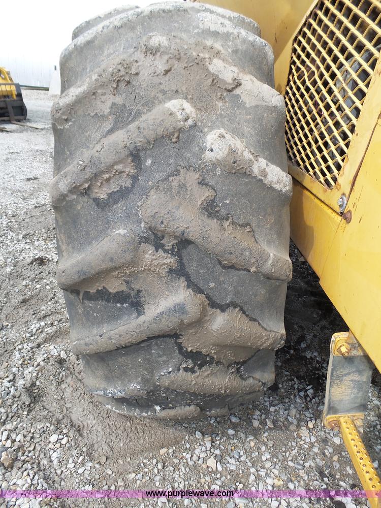 image for item K8446 1988 Caterpillar CP553 single drum pad foot compactor