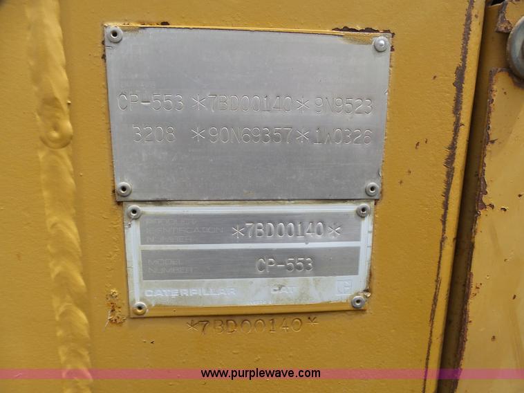 image for item K8446 1988 Caterpillar CP553 single drum pad foot compactor