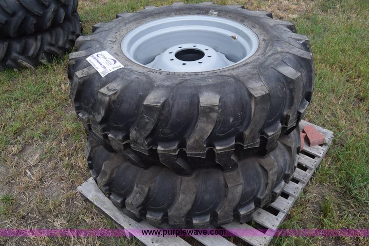 image for item L2624 (2) 14.9-24 tractor tires and wheels