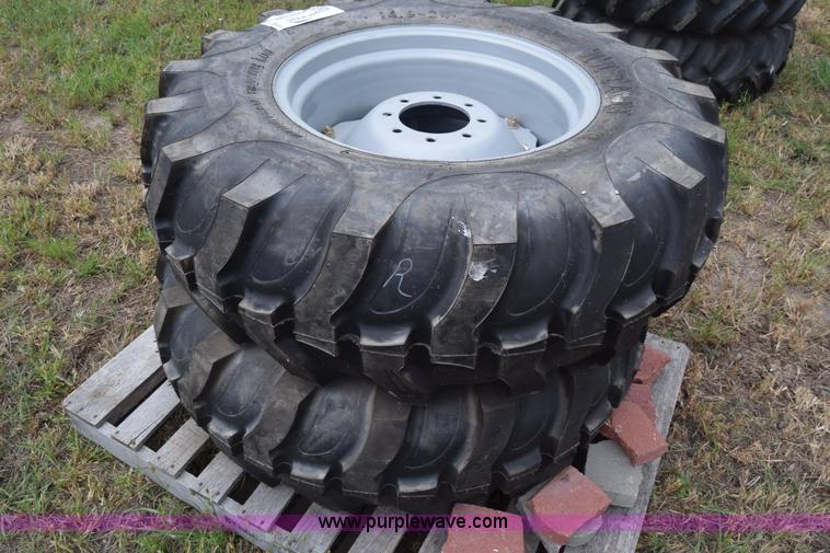 image for item L2624 (2) 14.9-24 tractor tires and wheels