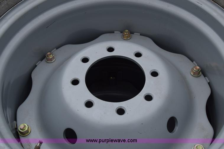 image for item L2624 (2) 14.9-24 tractor tires and wheels