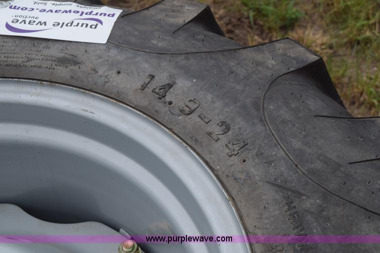 image for item L2624 (2) 14.9-24 tractor tires and wheels