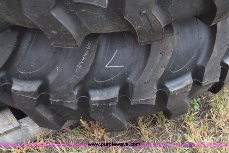 image for item L2624 (2) 14.9-24 tractor tires and wheels