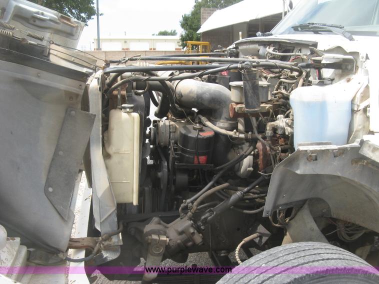 image for item J2755 1989 Ford F700F flatbed truck with crane