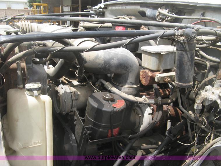 image for item J2755 1989 Ford F700F flatbed truck with crane