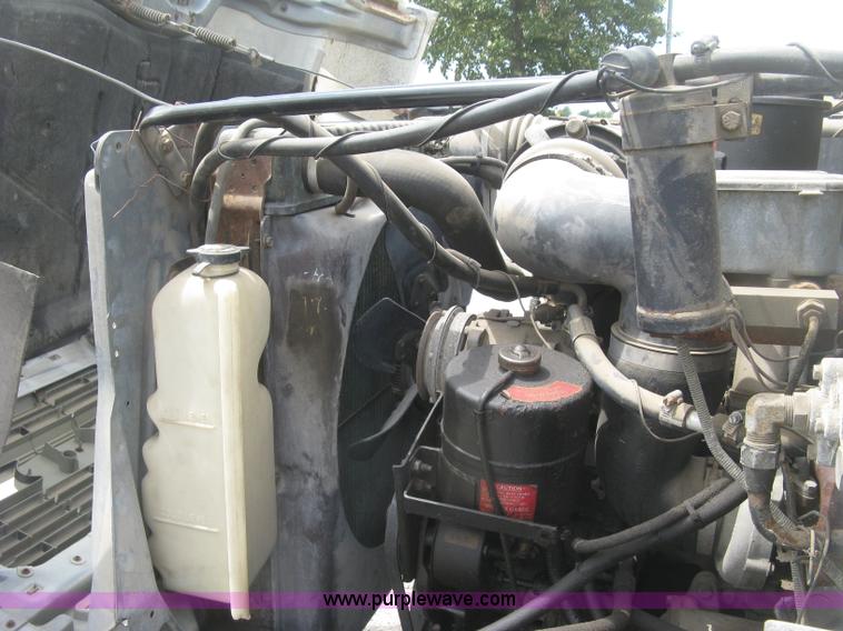 image for item J2755 1989 Ford F700F flatbed truck with crane