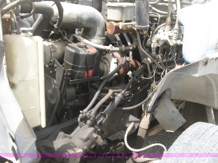 image for item J2755 1989 Ford F700F flatbed truck with crane