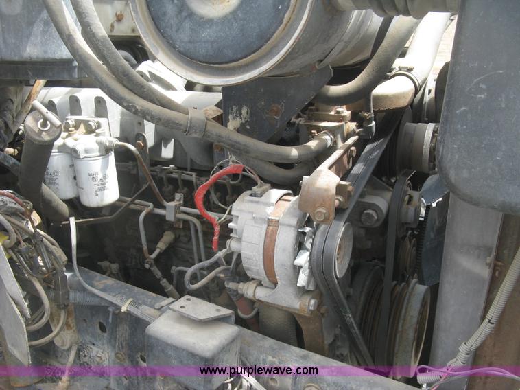 image for item J2755 1989 Ford F700F flatbed truck with crane