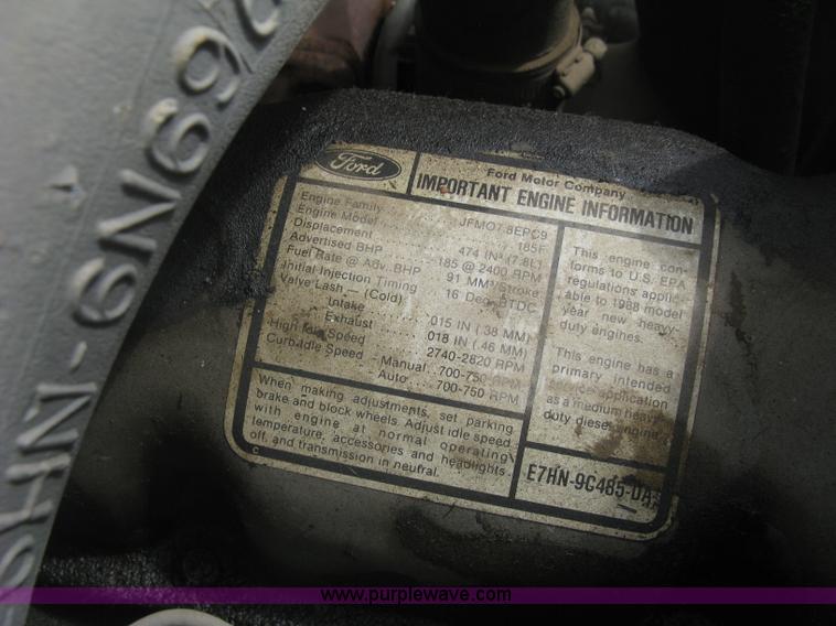 image for item J2755 1989 Ford F700F flatbed truck with crane