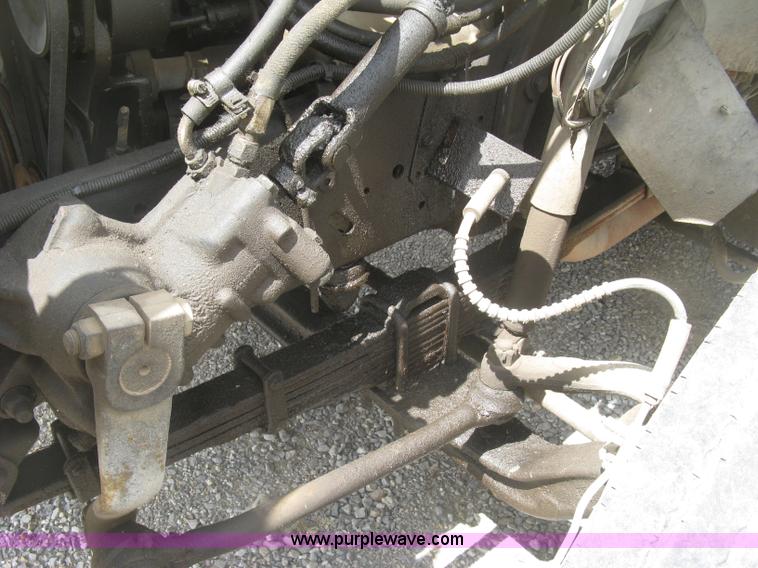 image for item J2755 1989 Ford F700F flatbed truck with crane